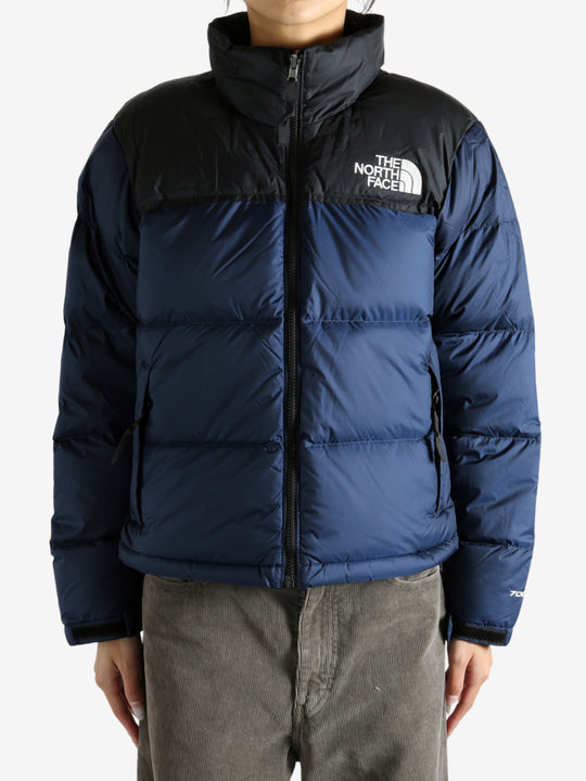 Navy jacket worn by a person, showing the jacket fit