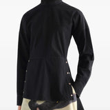 Black top worn by a person, showing the top fit