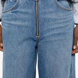 Close up of the blue jeans, showing texture of the cotton fabric