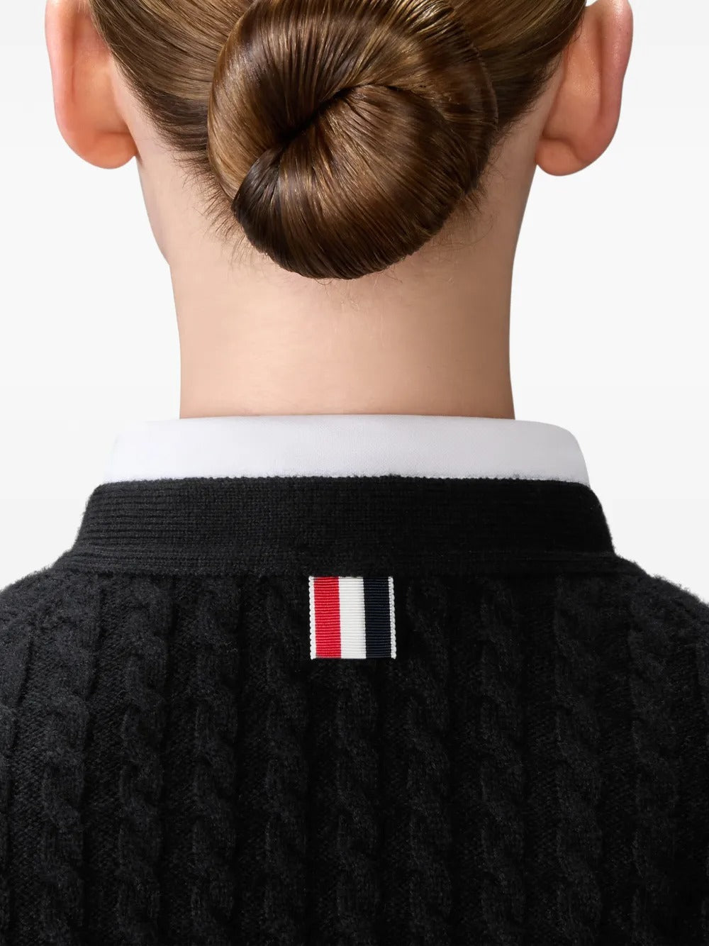 Close up of black cardigan, showing texture of the cashmere fabric