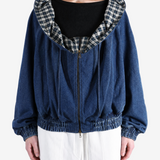 Blue jacket worn by a person, showing the jacket fit