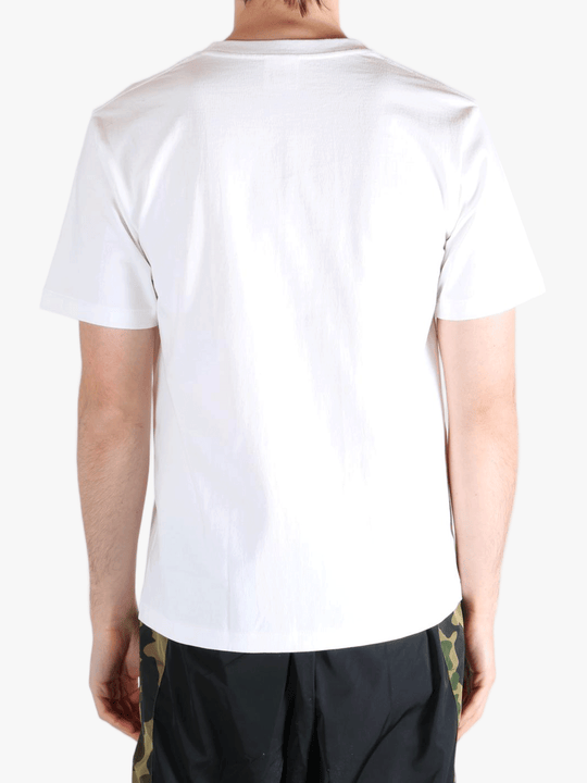 White t-shirt worn by a person, showing the shirt's fit