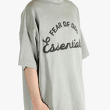 Grey t-shirt worn by a person, showing the t-shirt's fit