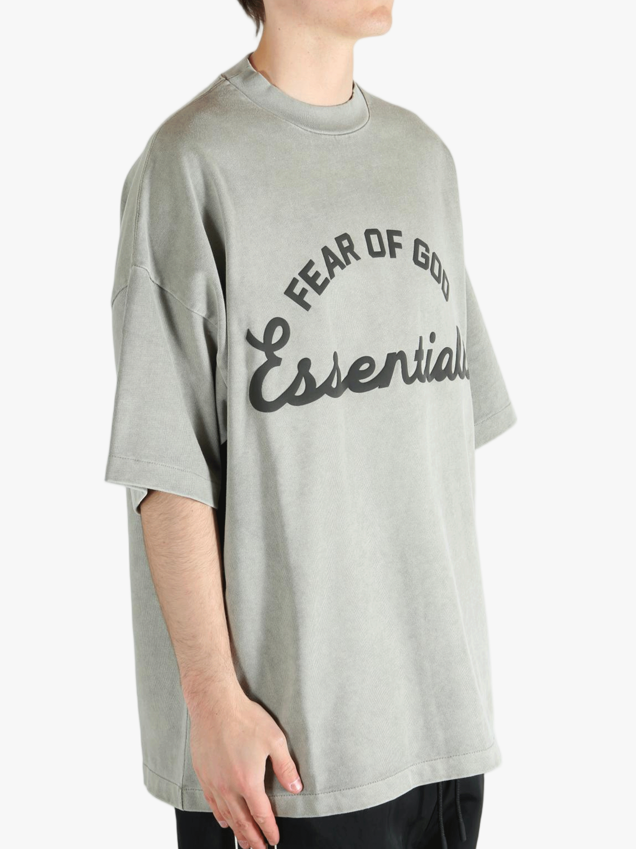 Grey t-shirt worn by a person, showing the t-shirt's fit