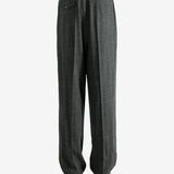 Black pants worn by a person, showing the pants fit