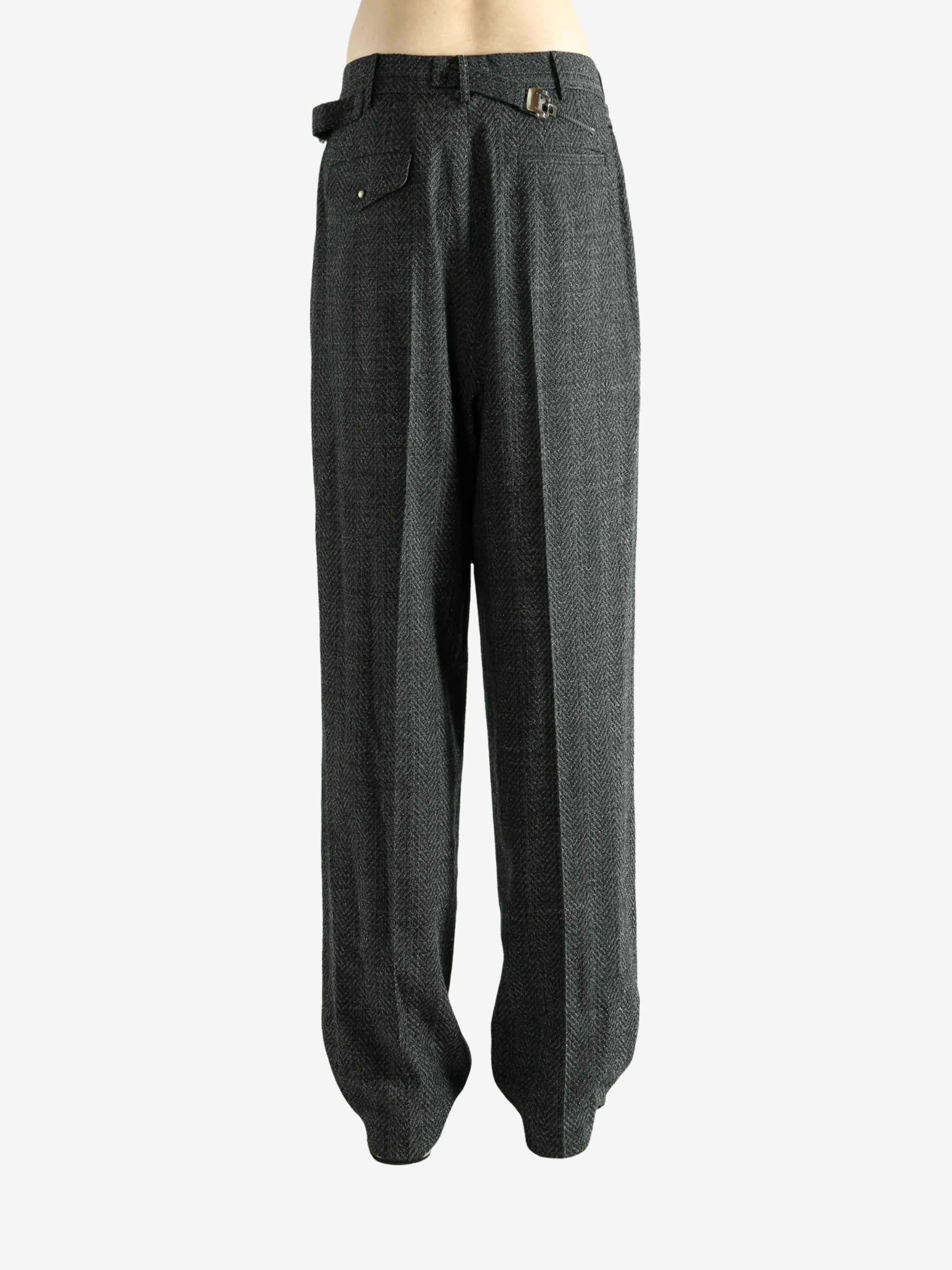 Black pants worn by a person, showing the pants fit