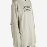 Tan hoodie worn by a person, showing the hoodie's fit