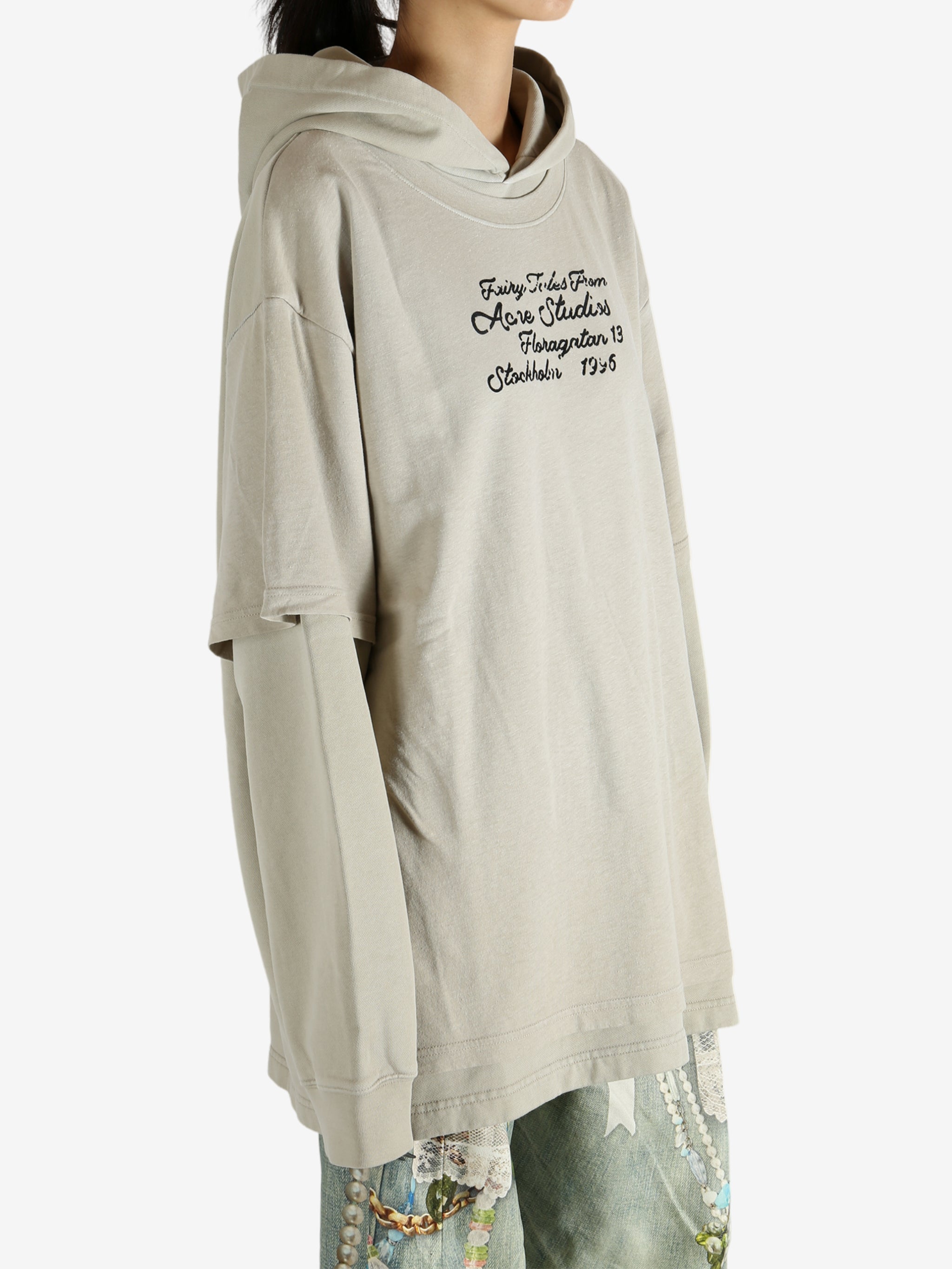 Tan hoodie worn by a person, showing the hoodie's fit