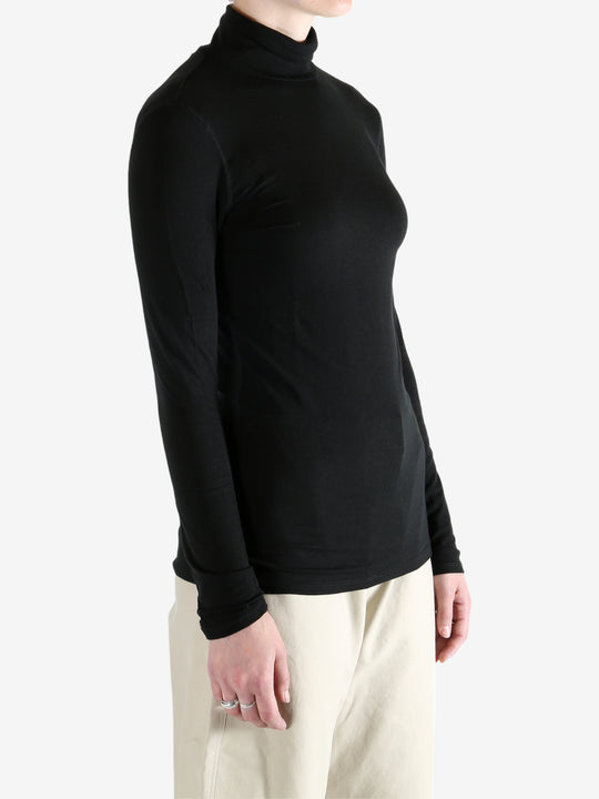 Black t-shirt worn by a person, showing the shirt's fit