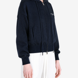 Navy hoodie worn by a person, showing the hoodie fit