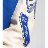 Close up of Blue jacket, showing texture of the 75% wool/ 25% nylon fabric