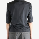 Grey t-shirts worn by a person, showing the t-shirts fit