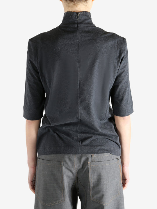 Grey t-shirts worn by a person, showing the t-shirts fit