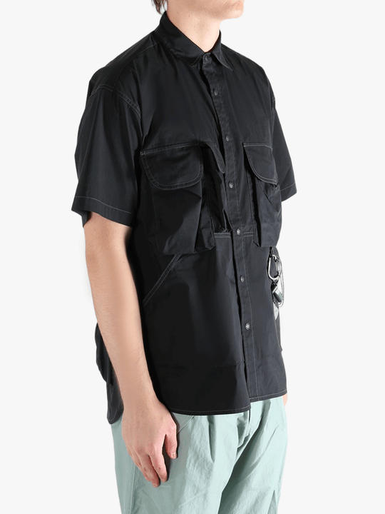 Black shirts worn by a person, showing the shirts fit