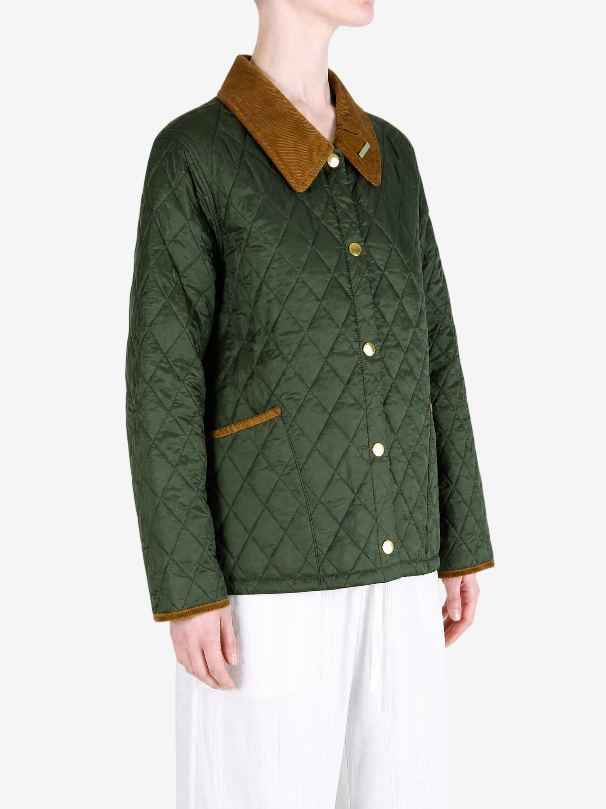 Green jacket worn by a person, showing the jacket fit