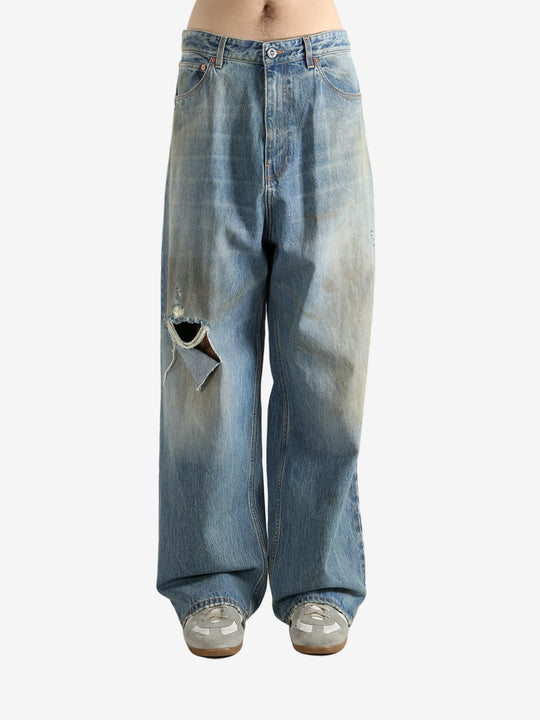 Blue pants worn by a person, showing the pants fit