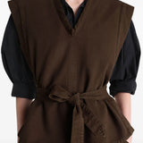 Brown top worn by a person, showing the top's fit