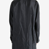 Black shirt worn by a person, showing the shirt's fit