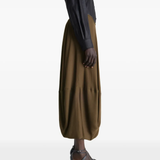 Brown skirt worn by a person, showing the skirt's fit