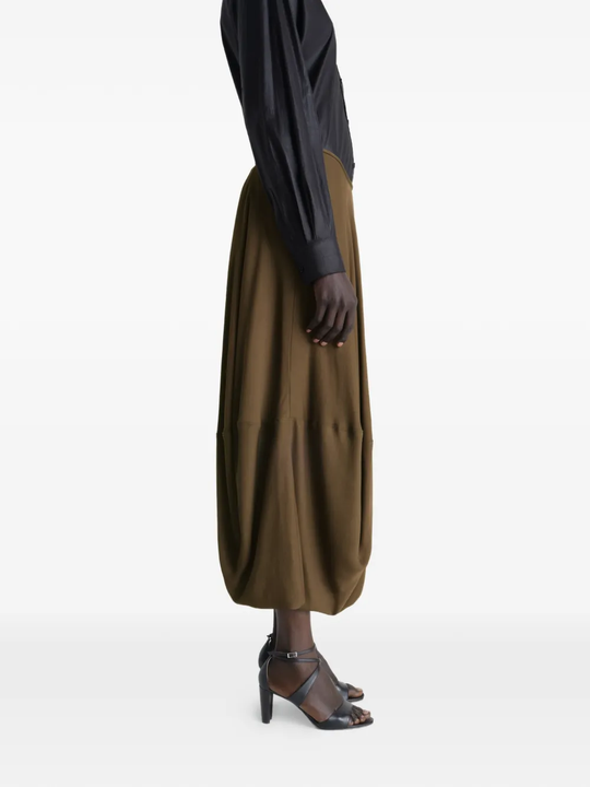 Brown skirt worn by a person, showing the skirt's fit