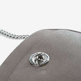 Close up of grey bag, showing texture of the cow leather fabric