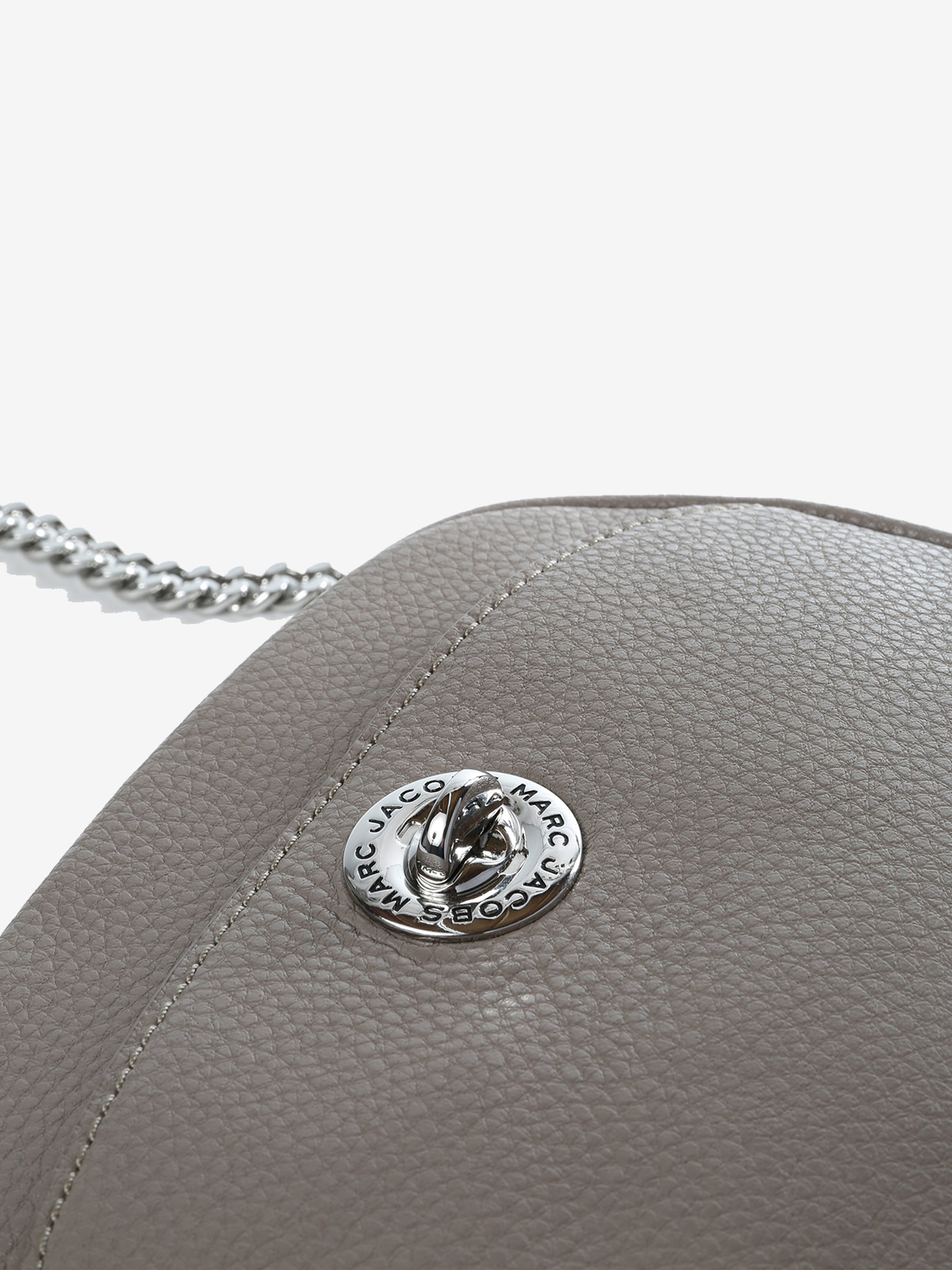 Close up of grey bag, showing texture of the cow leather fabric