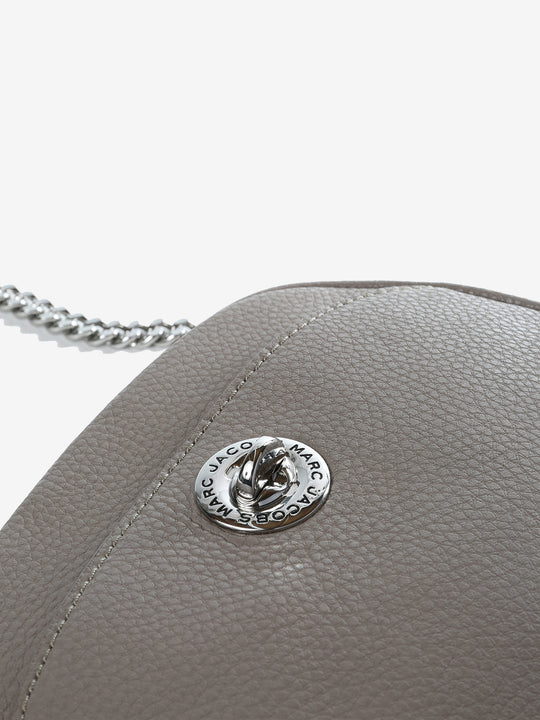 Close up of grey bag, showing texture of the cow leather fabric
