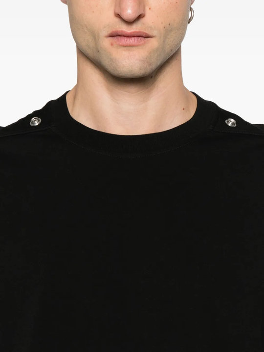 Close up of the black t-shirt, showing texture of the cotton fabric