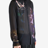 Black shirt worn by a person, showing the shirt's fit