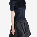 Navy top worn by a person, showing the top's fit