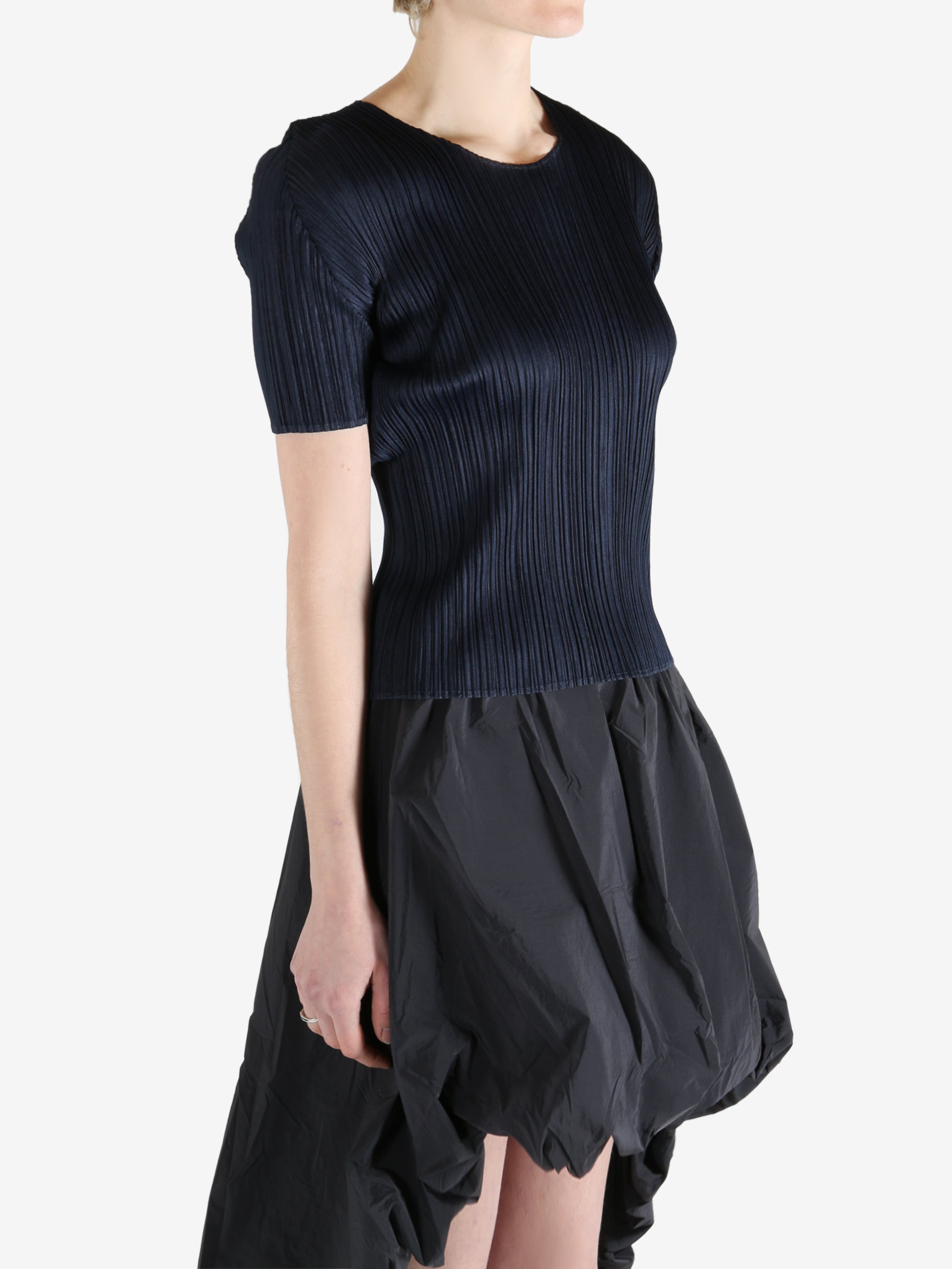 Navy top worn by a person, showing the top's fit