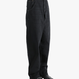 Black jean,worn by a person, showing the jeans fit