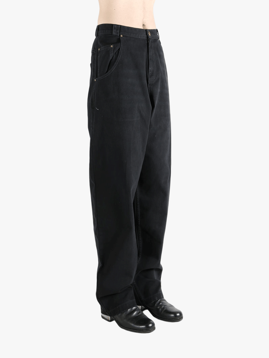 Black jean,worn by a person, showing the jeans fit