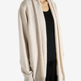 Tan cardigan worn by a person, showing the cardigan's fit