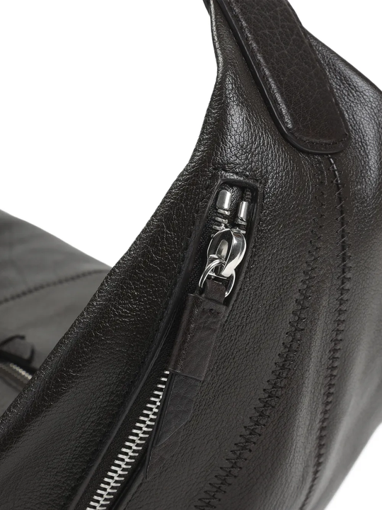 close up of black bags, showing texture of the cow leather fabric