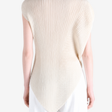 Tan shirt worn by a person, showing the shirt fit