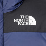 Close up of navy jackets, showing texture of the recycled nylon and recycled polyester and goose down fabric