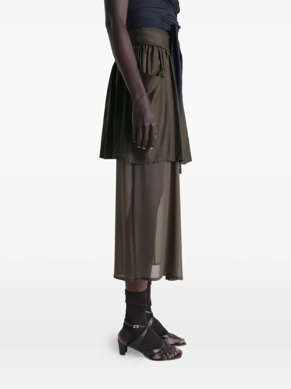 Brown skirt worn by a person, showing the skirt fit