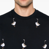 Close up of the blue t-shirt, showing texture of the cotton fabric