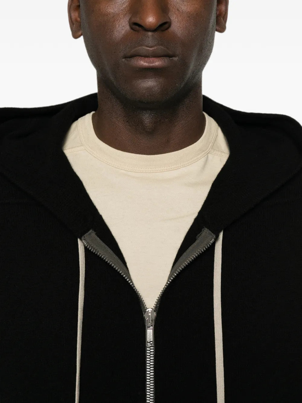 Black hoodie worn by a person, showing the hoodie fit