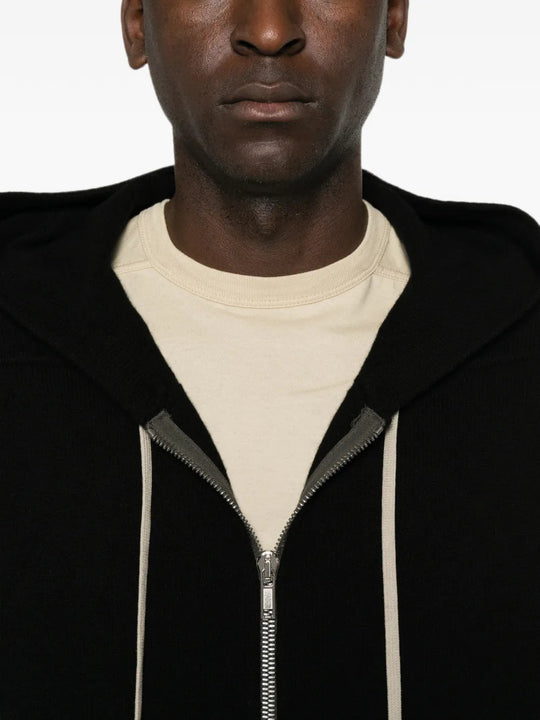 Black hoodie worn by a person, showing the hoodie fit