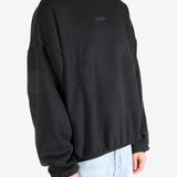  Black tops worn by a person, showing the tops fit