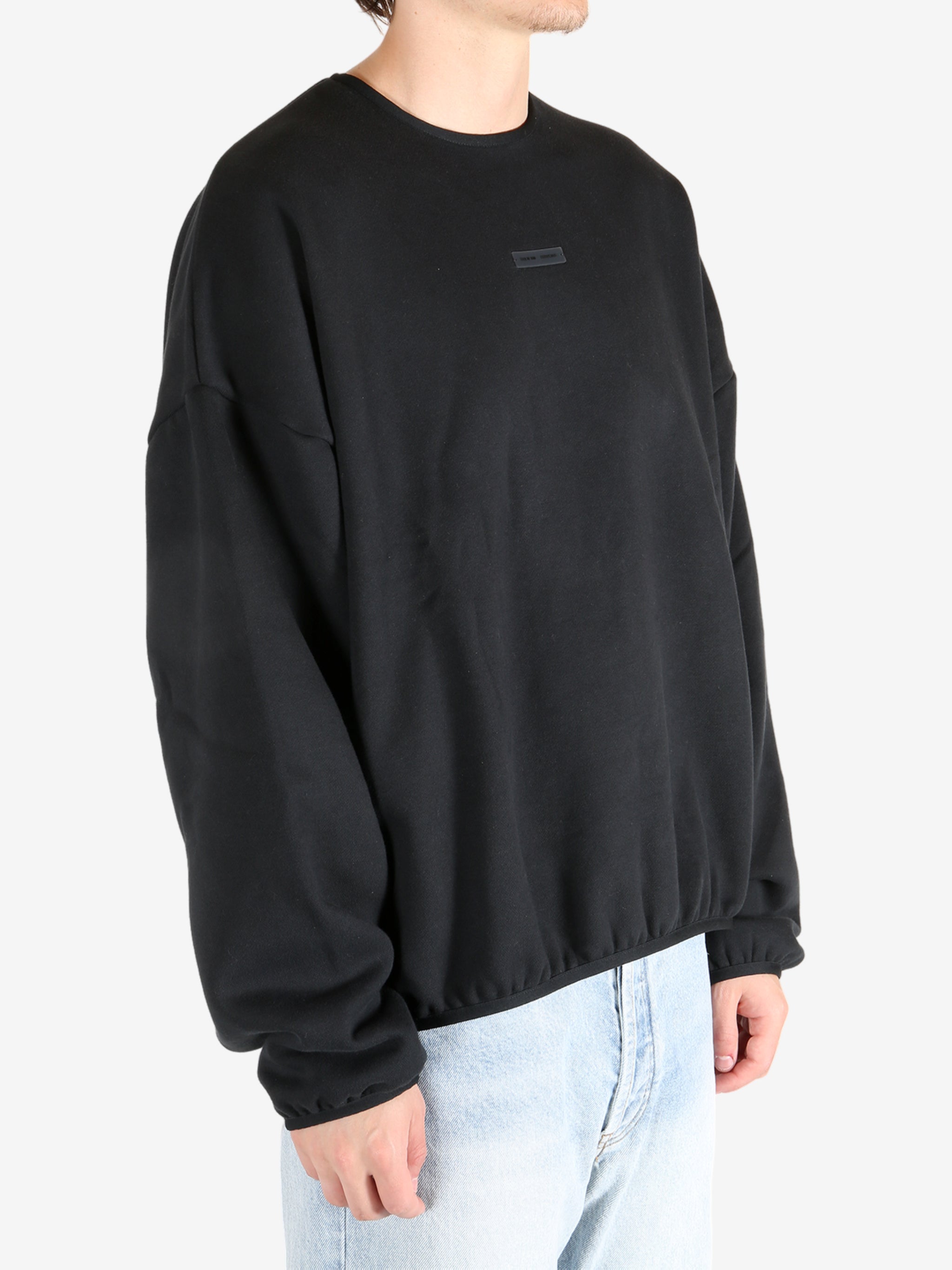  Black tops worn by a person, showing the tops fit