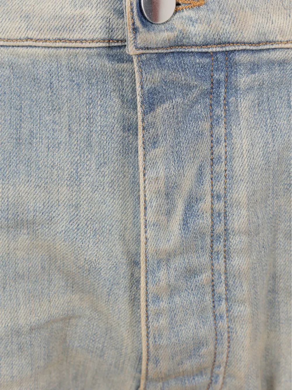 Close up of the blue jeans, showing texture of the cotton fabric