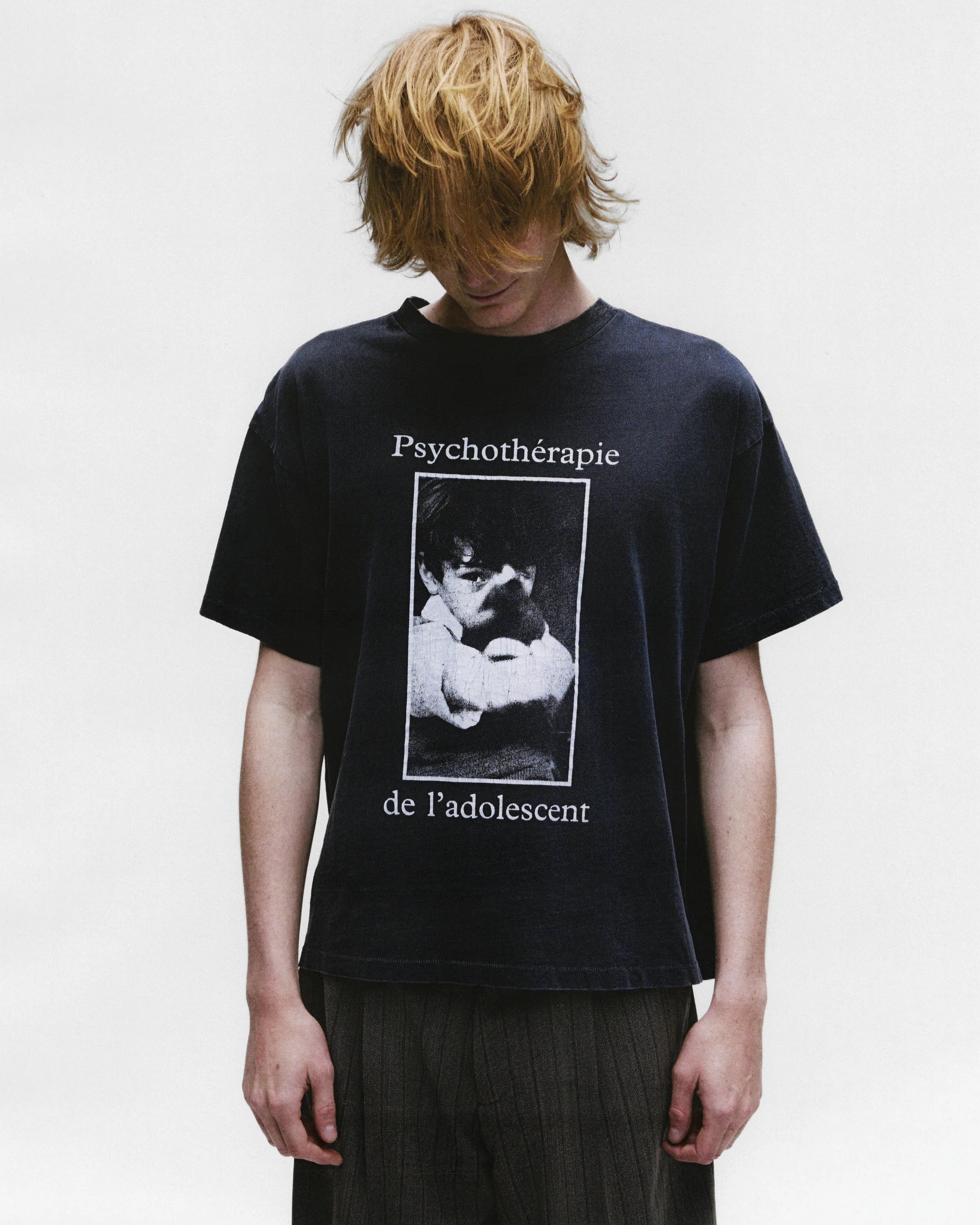 Black shirts worn by a person, showing the shirts fit