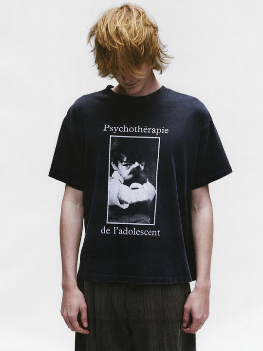 Black shirts worn by a person, showing the shirts fit