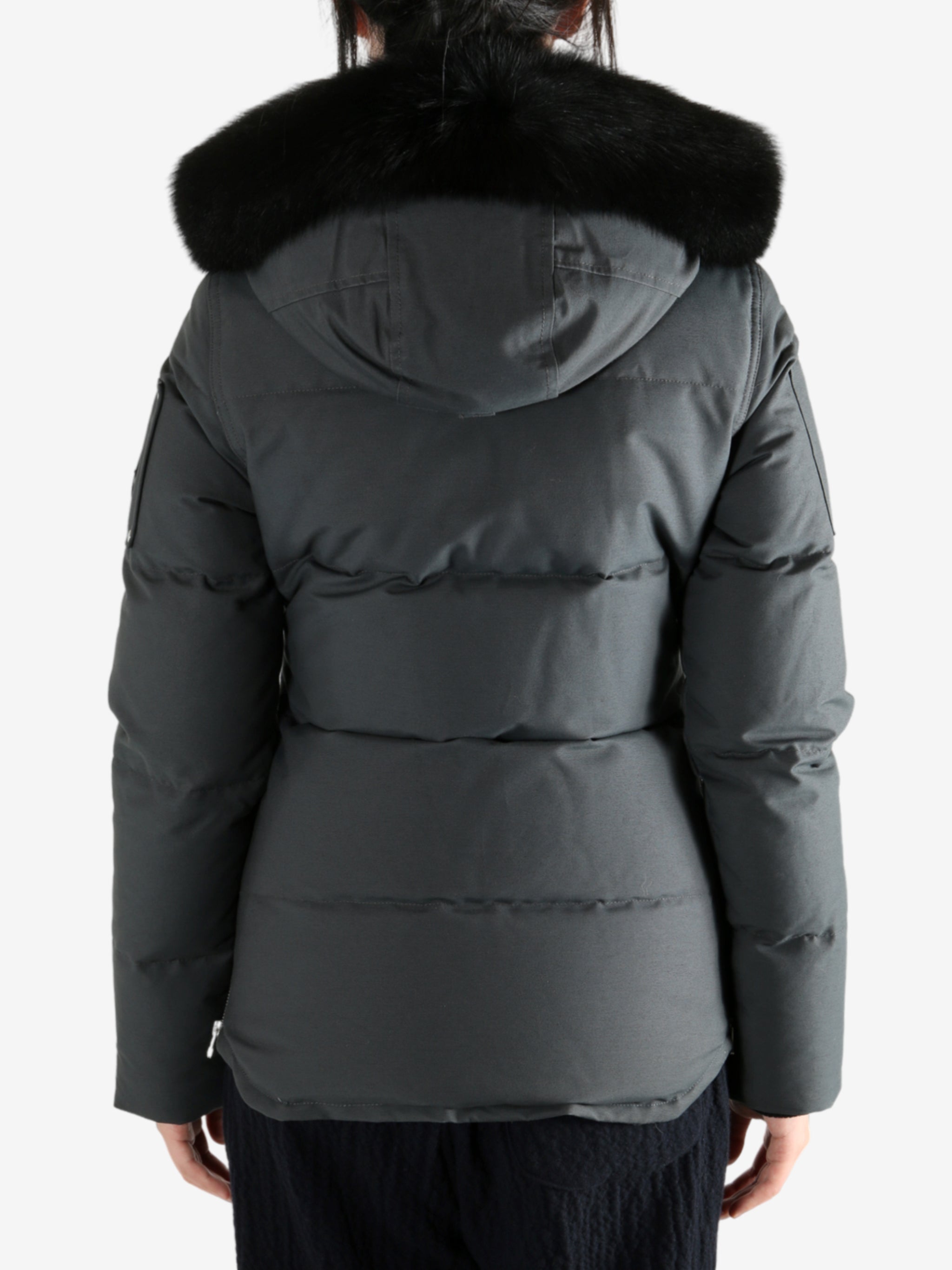 Black jackets worn by a person, showing the jackets fit