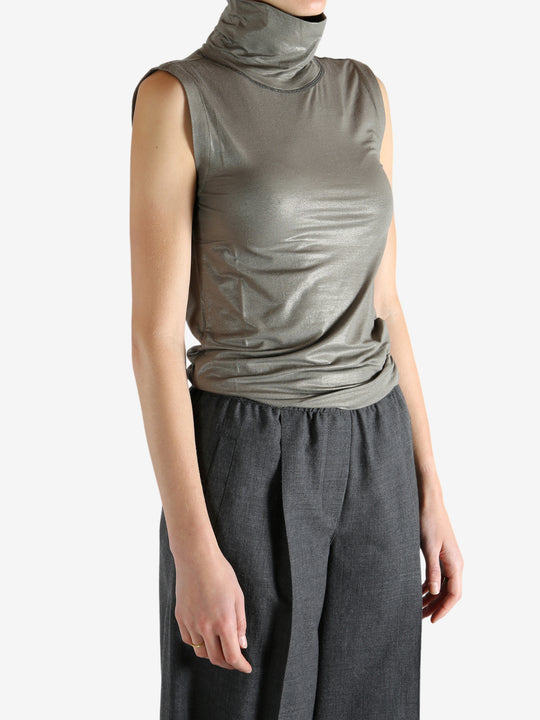 Grey tops worn by a person, showing the tops fit