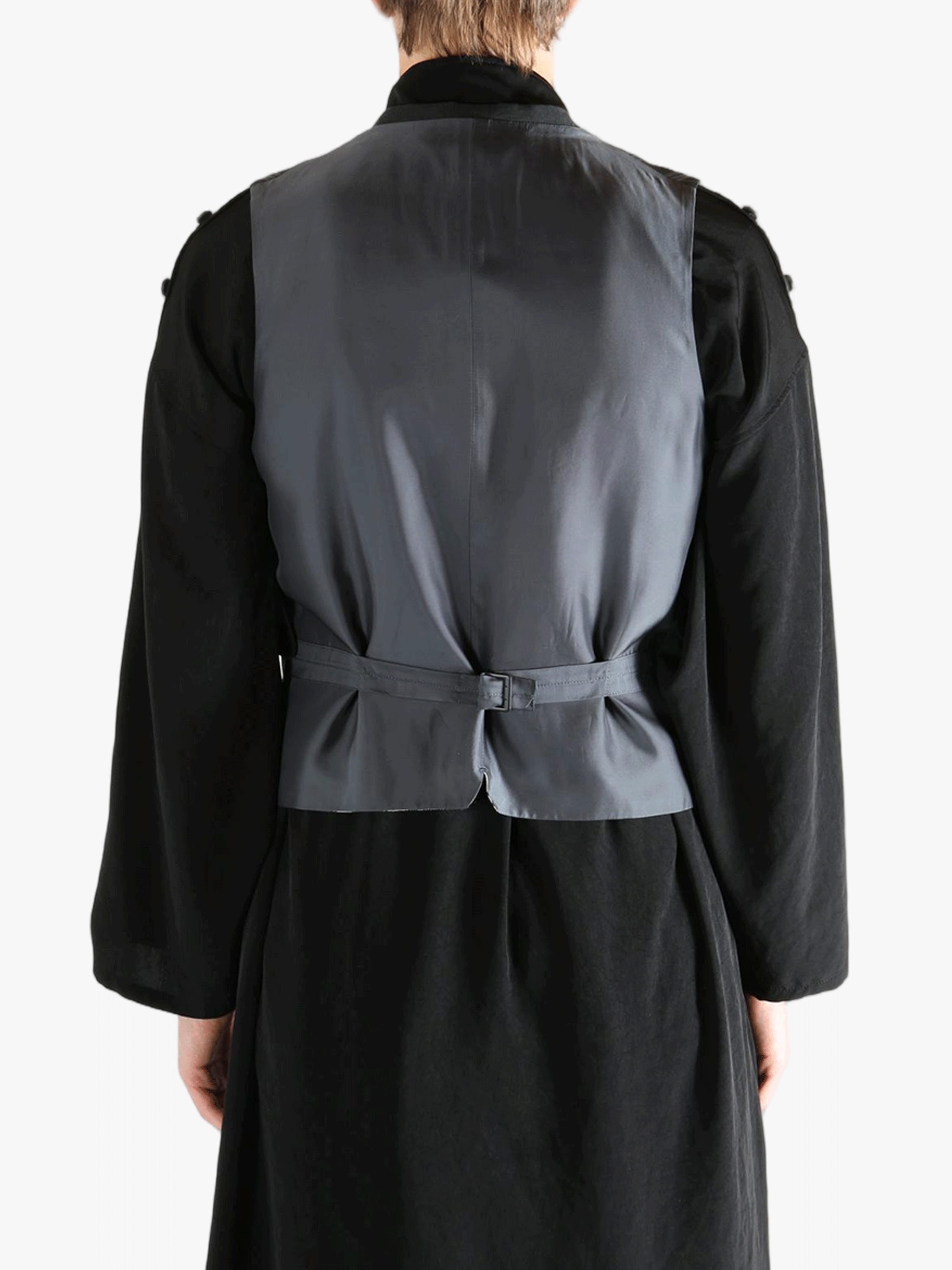 Black vest worn by a person, showing the vest's fit