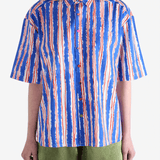 Blue shirts worn by a person, showin the shirt's fit